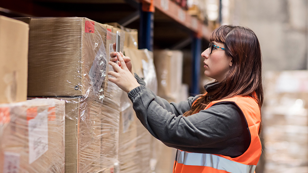 Woman-Scanning-Barcode-In-Warehouse.jpg