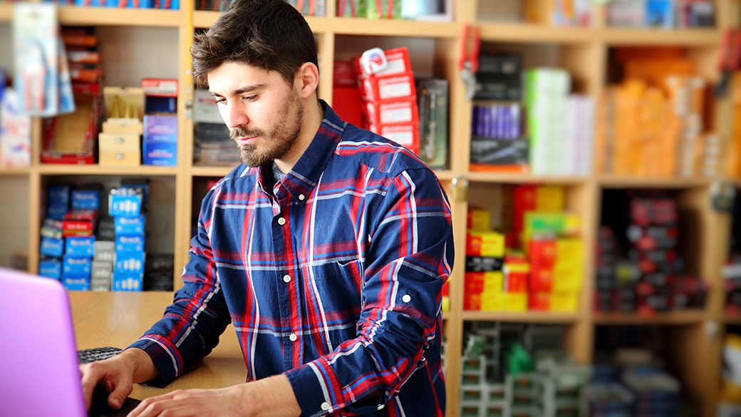 RET-Worker-in-hardware-store-with-laptop.jpg