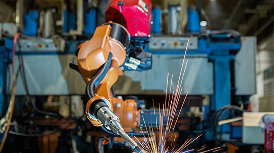 Robotic arm in manufacturing warehouse